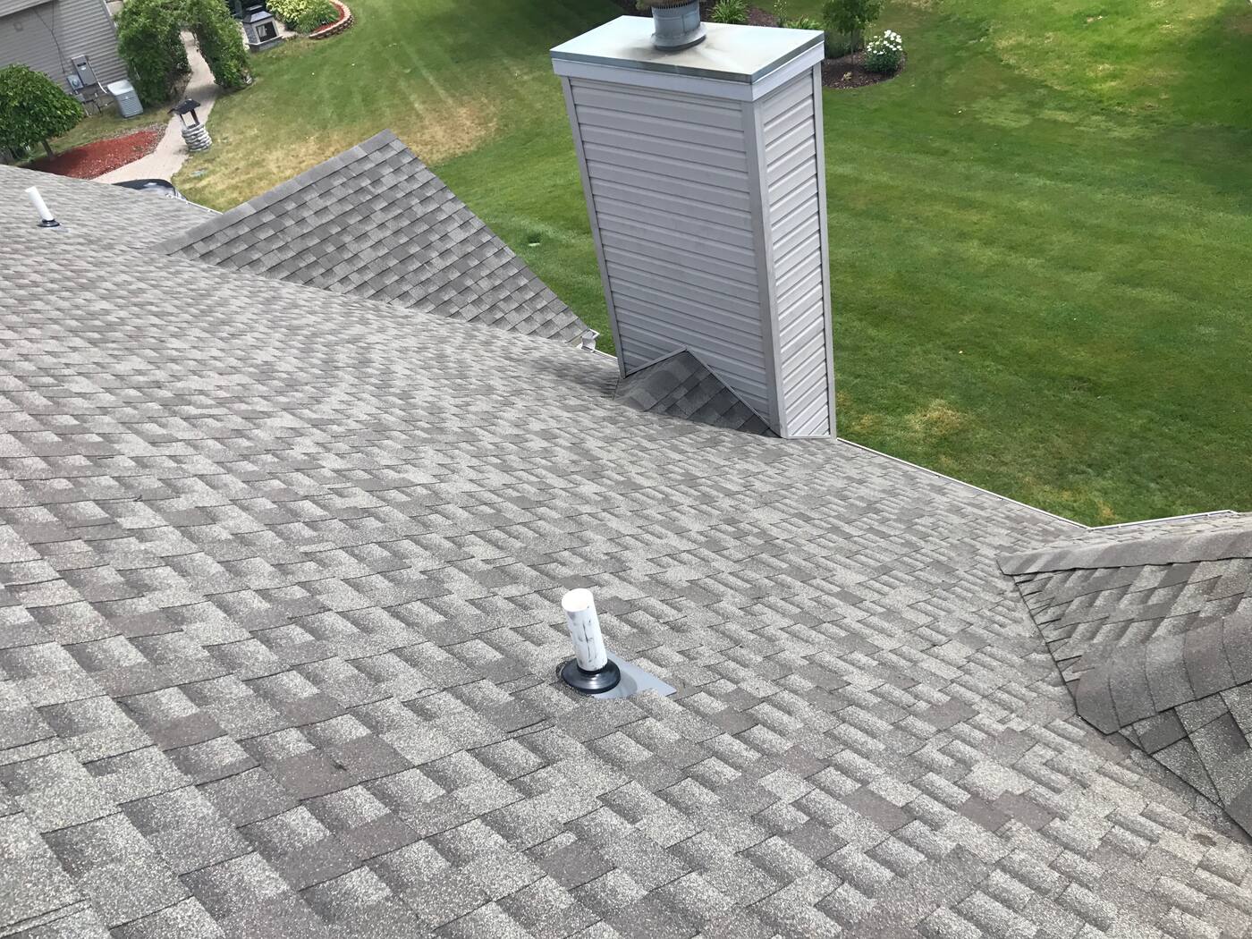 Chimney chase flashed into new shingles