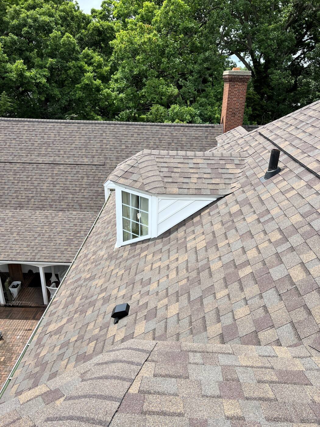 Dormer and chimney flashed into a designer shingle roof