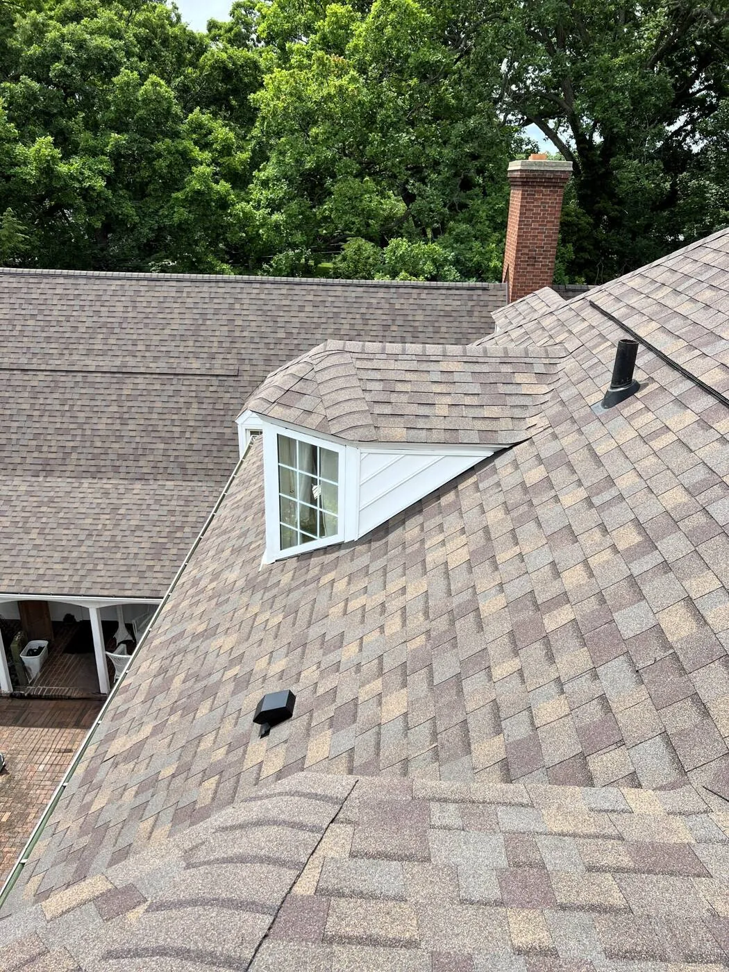 Dormer and chimney flashed into a designer shingle roof