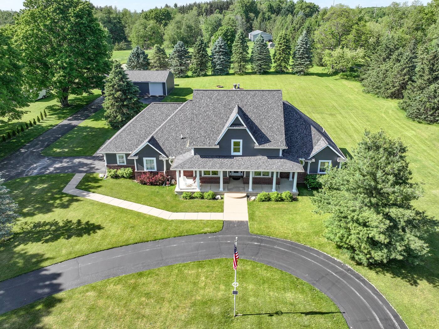 Drone view of a new roof on a craftsman-style home