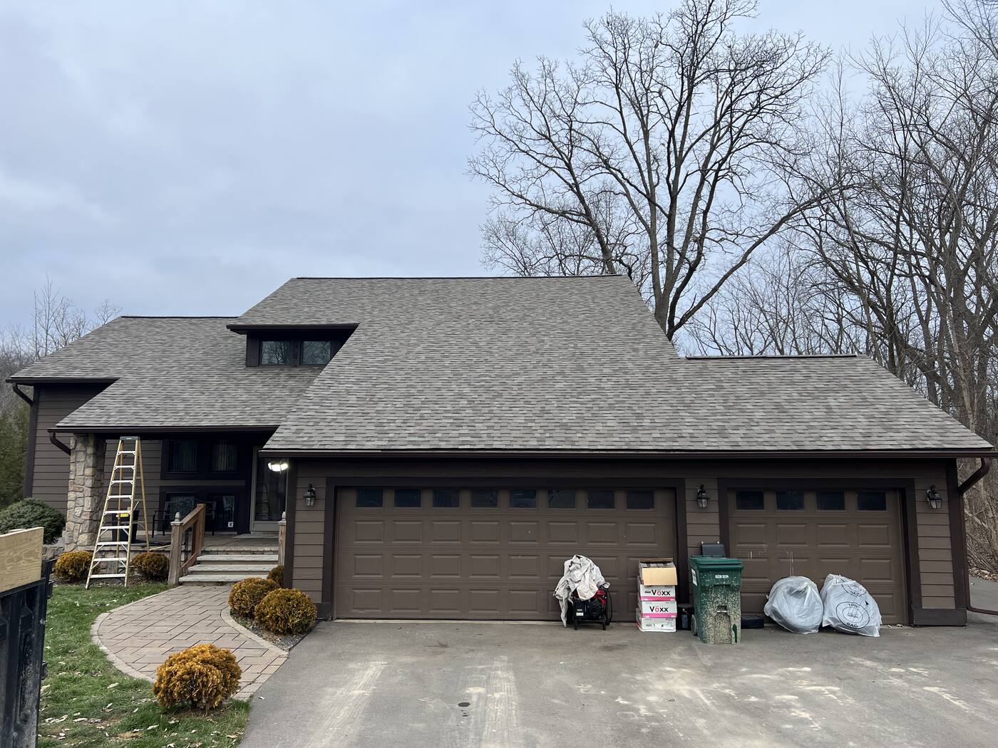 Tear-off day: old shingles down, new roof going on