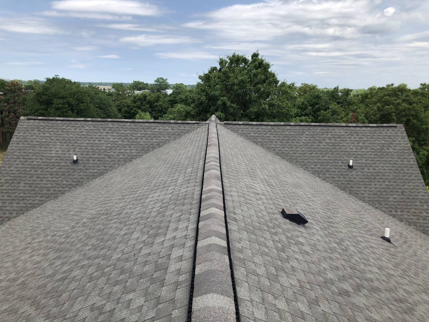Finished roof on a home backing up to a wooded lot