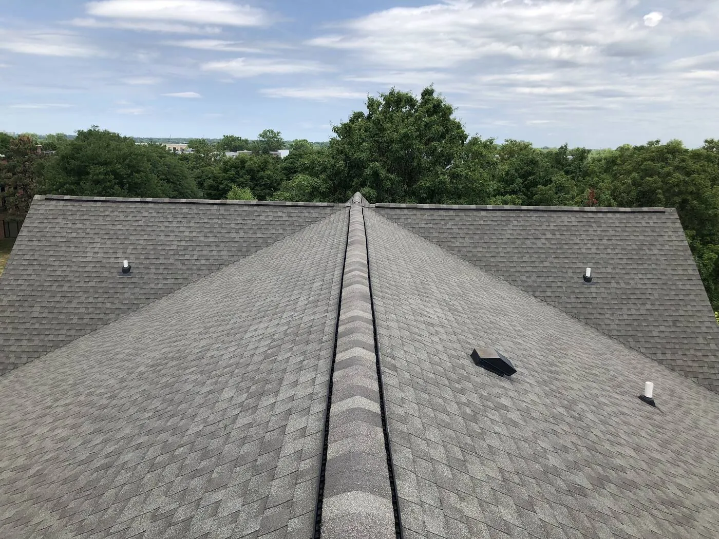 Finished roof on a home backing up to a wooded lot