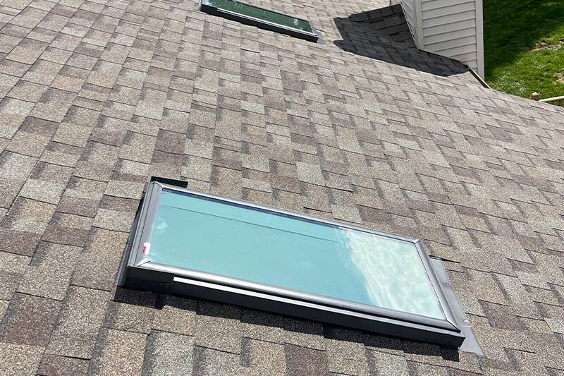 Skylight flashing detail on a completed roof