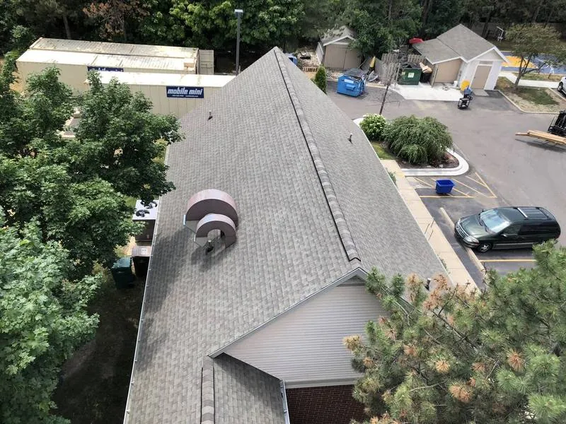 Aerial of a multi-family roof replacement in progress