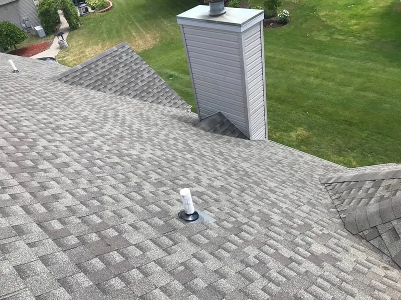 Chimney chase flashed into new shingles