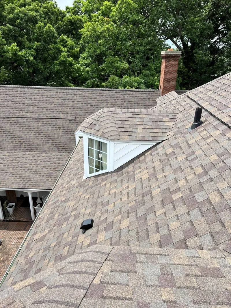 Dormer and chimney flashed into a designer shingle roof