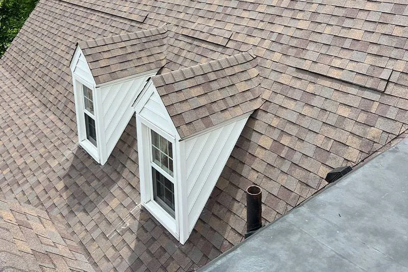 Close detail of dormers and designer shingle courses