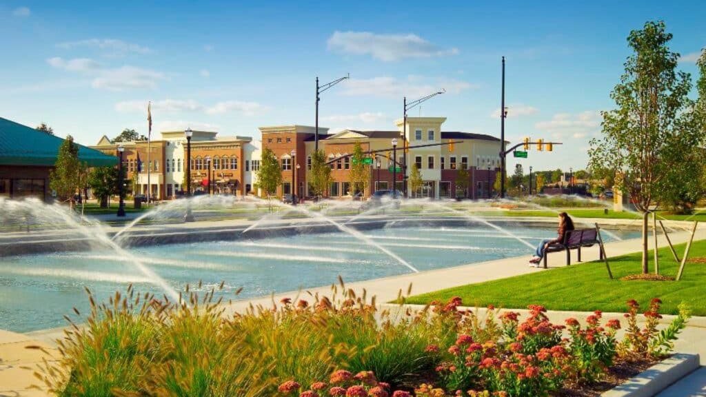 a fountain surrounded by flowers