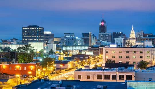 City skyline at dusk with illuminated buildings