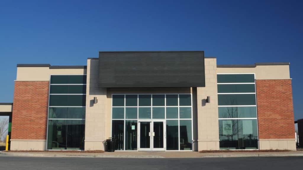 A modern commercial building with large windows