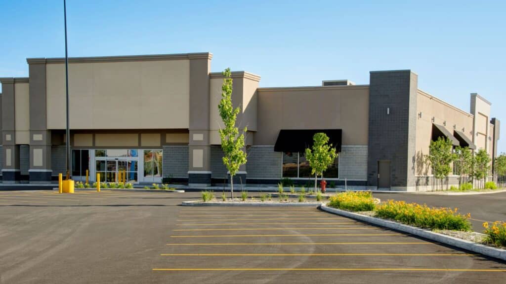 A large, empty retail building with a blank facade