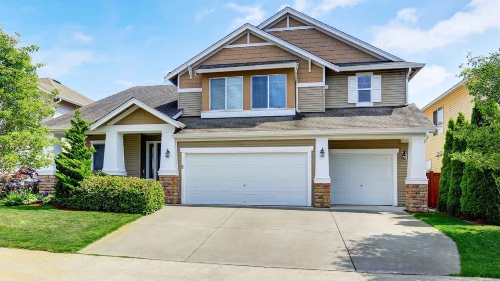 Two-story suburban house with beige siding