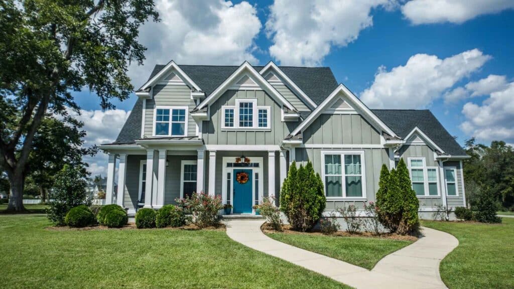 A two-story suburban house with gray siding